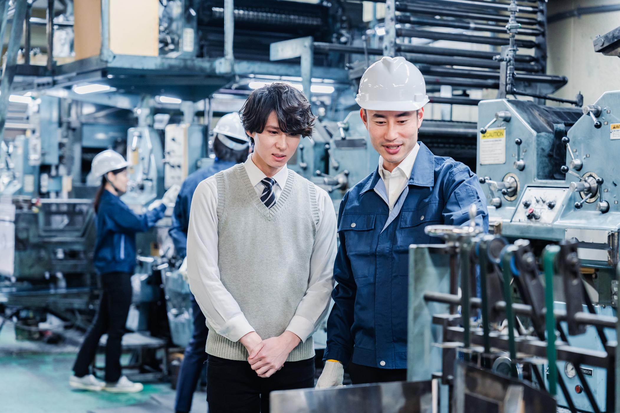 Male students touring the factory