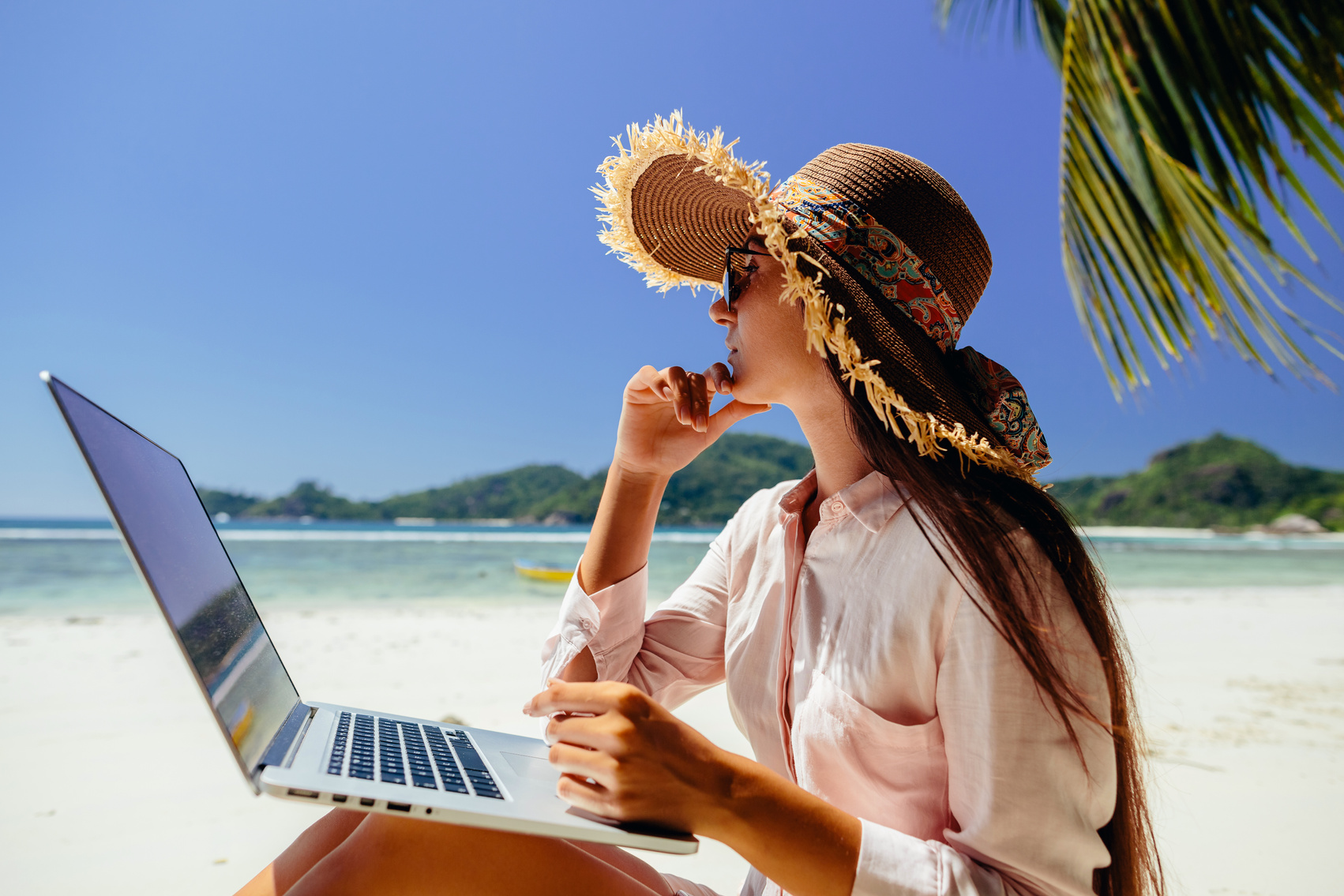 Female Freelancer on the Beach in Tropics